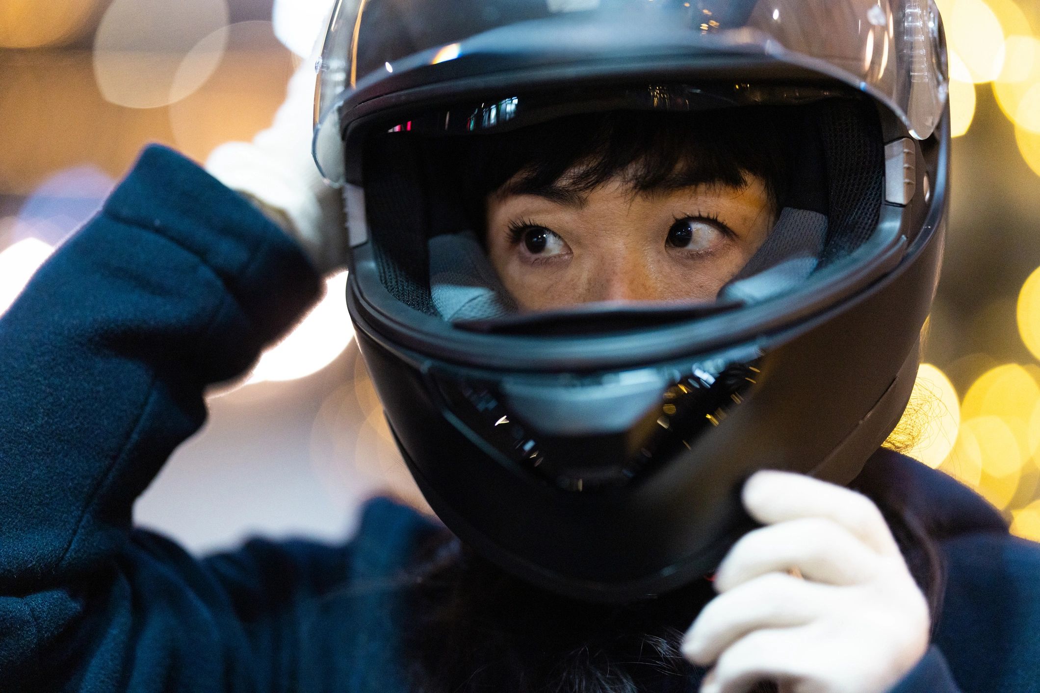 Close-up of a rider wearing a protective motorcycle helmet